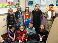 Crew of puppies dressed up with their favourite books