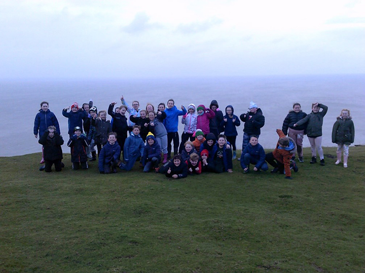 children on a hilltop